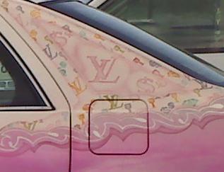 I didn't know Vuitton did cars. Clearly this is a man of great affluence. Hence the dollar bill signs.